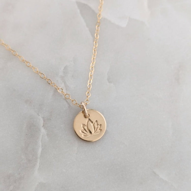 gold disc with lotus flower design