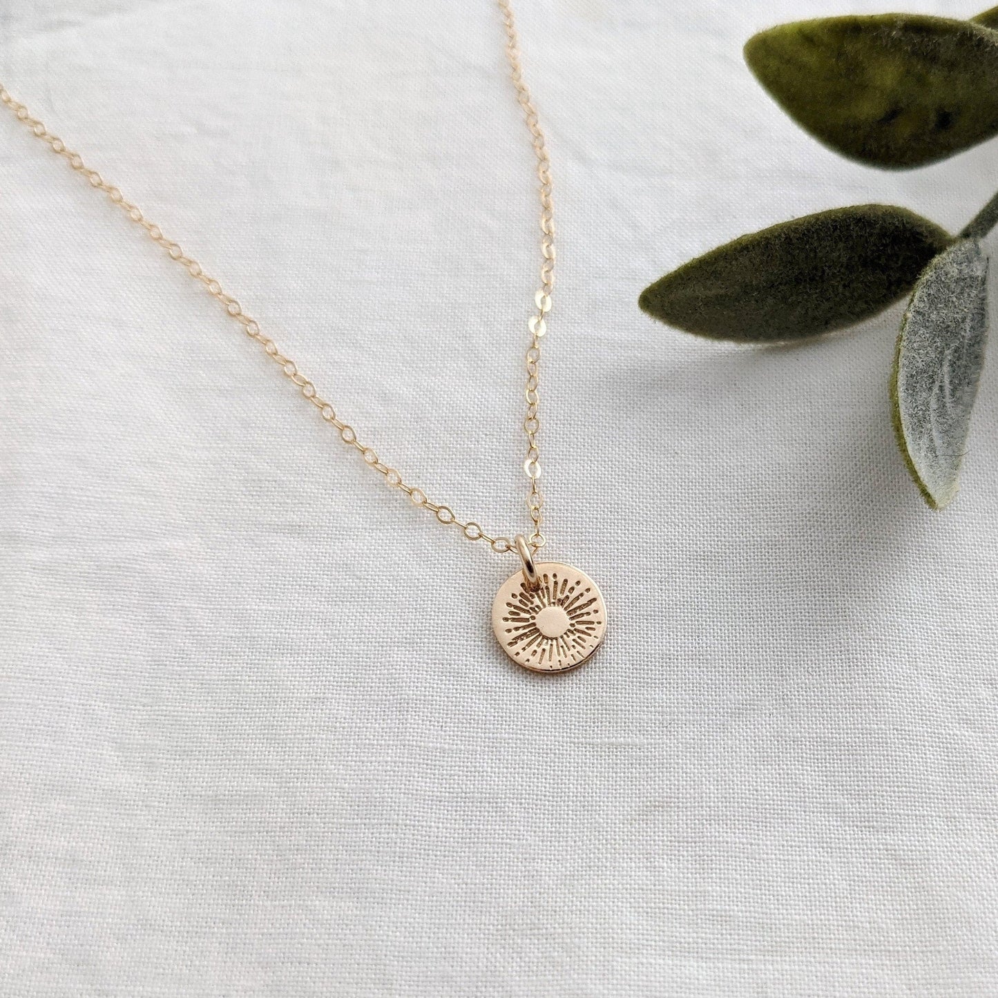 gold sunburst charm necklace