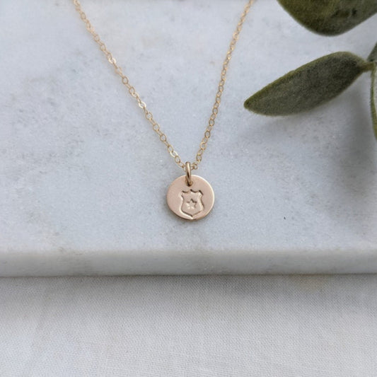 gold filled necklace with police badge design