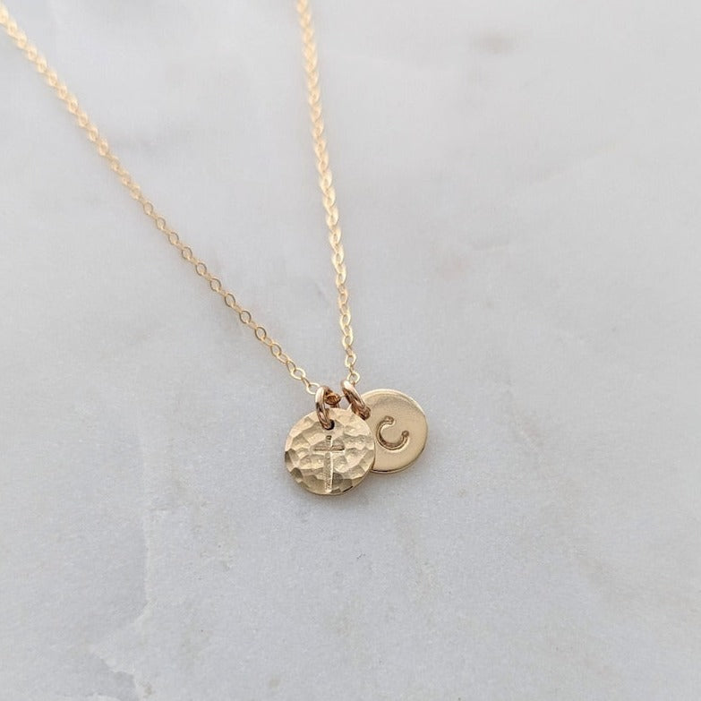 gold necklace with cross and initial charm