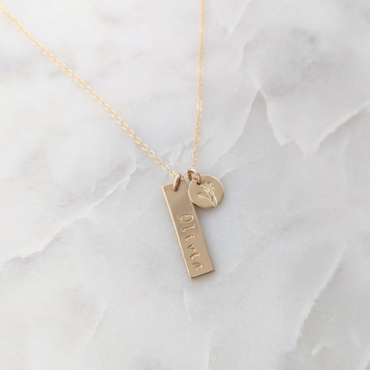 necklace with bar charm and name small disc with flower