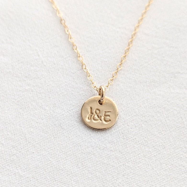 gold disc necklace with initials