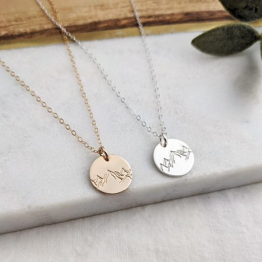 charm with mountain design, gold or silver
