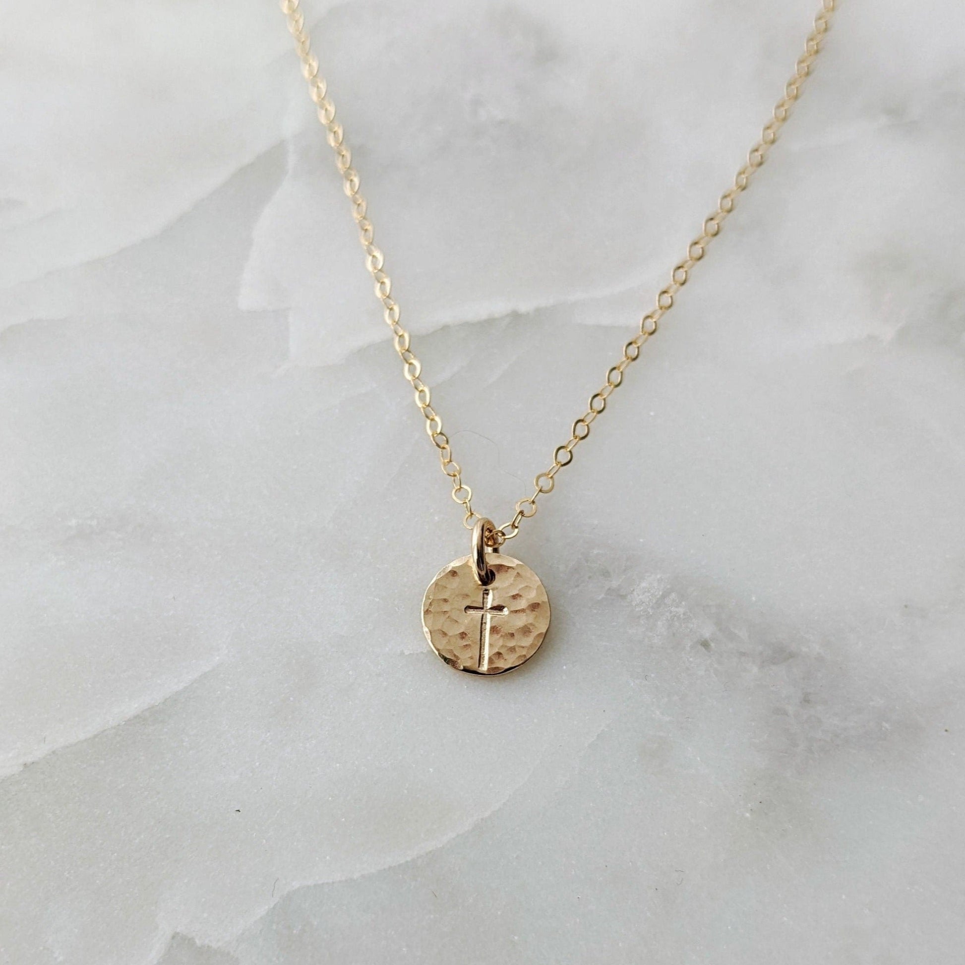 Tiny hammered gold filled disc with cross